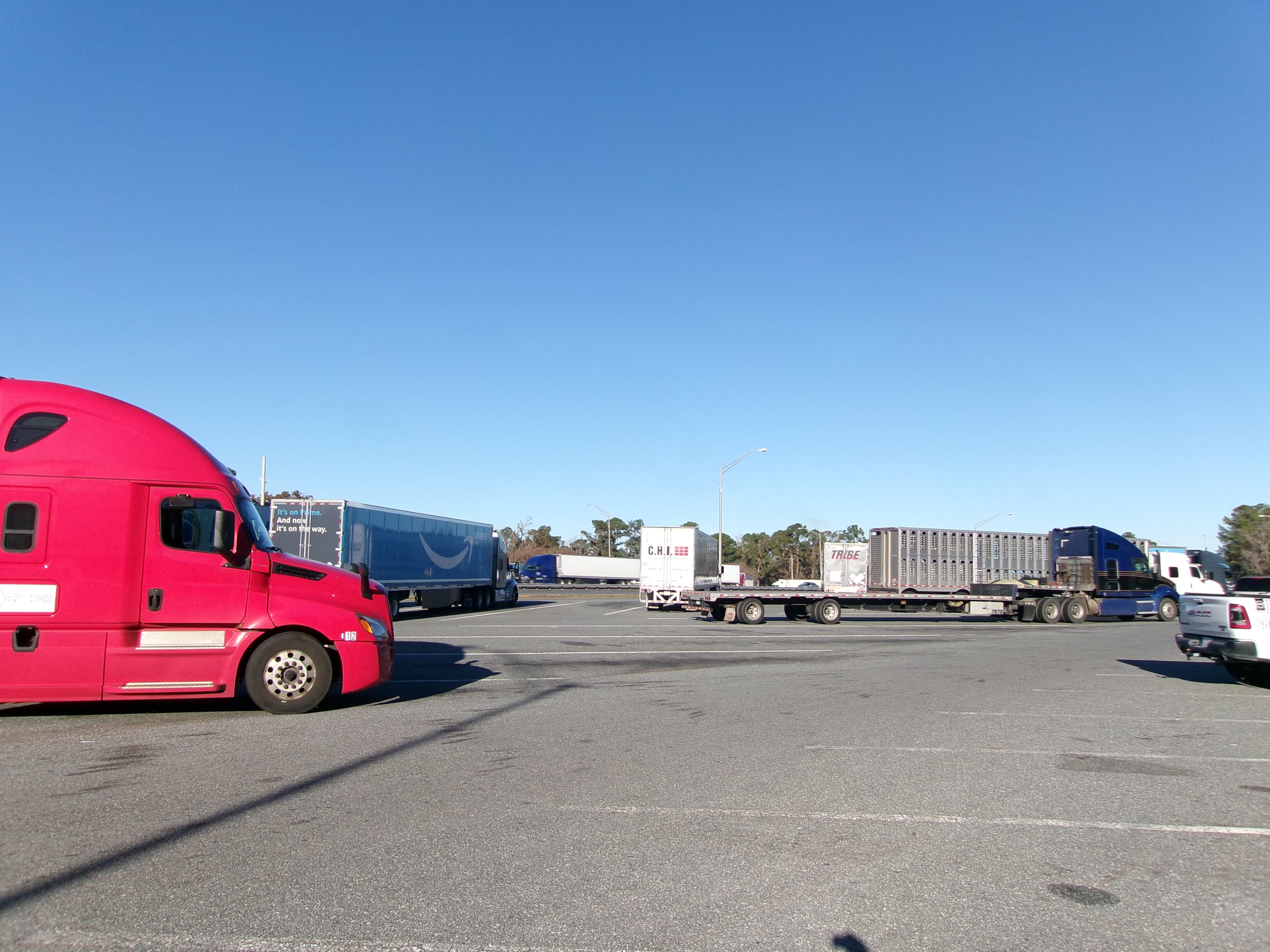 Interstate rest area with multiple semi-trailers parked