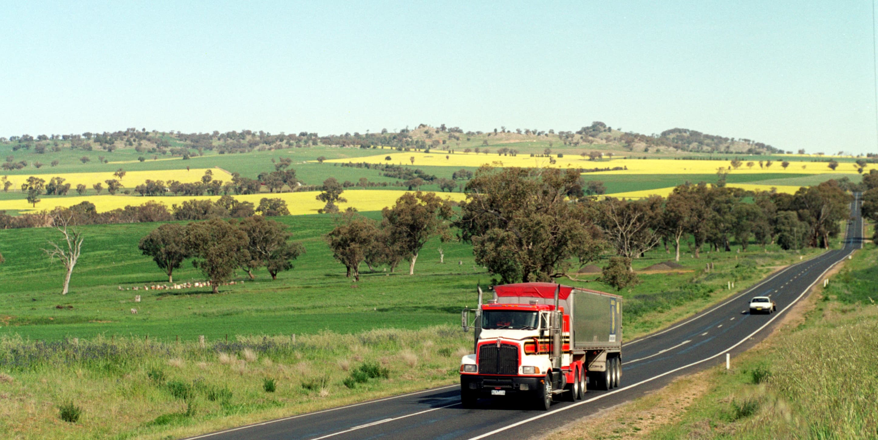 Semi-truck on a highway representing nationwide freight transportation and logistics